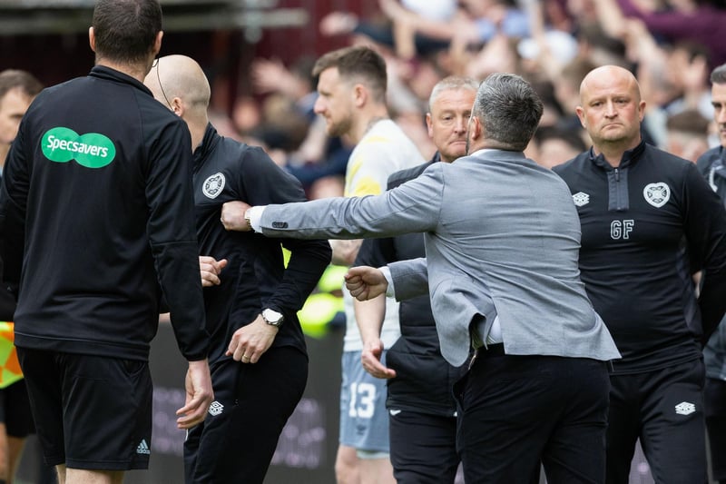 Steven Naismith turns away as Lee Johnson extends his left arm towards the Hearts boss