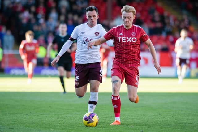 Lawrence Shankland battles with Aberdeen defender Liam Scales during Hearts' 2-0 defeat at Pittodrie earlier this season. Picture: SNS