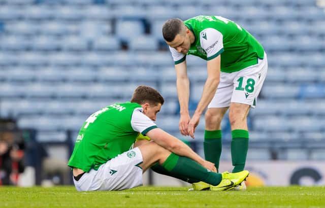 Jamie Murphy attempts to console Paul Hanlon at full time following St Johnstone's 1-0 win against Hibs in the Scottish Cup final