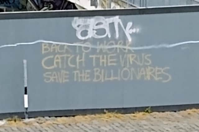 The message on hoarding surrounding an Edinburgh building site.