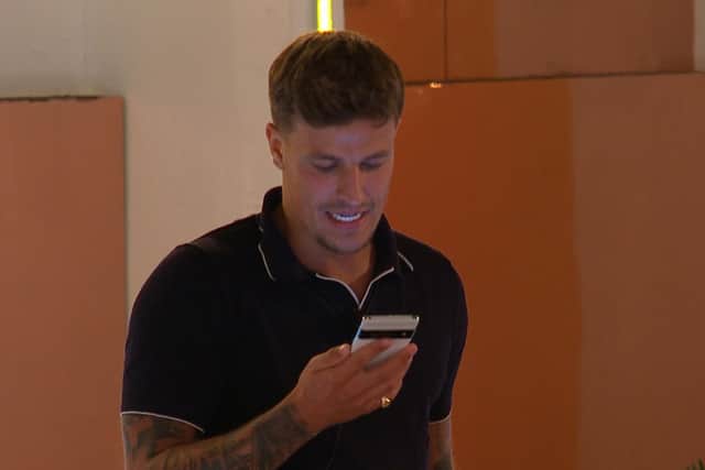 The text announcing the bombshells gives Luca a bizarre expression. Photo: ITV / Love Island.