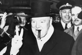 Winston Churchill gives his famous V-sign gesture on the campaign trail   Photo: Keystone/Hulton Archive/Getty Images