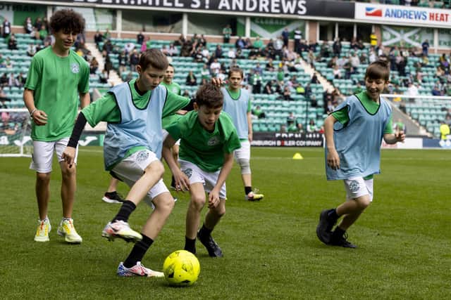 The kids got to play on the pitch at half-time at Easter Road in May, 2022. Photo by Alan Rennie.