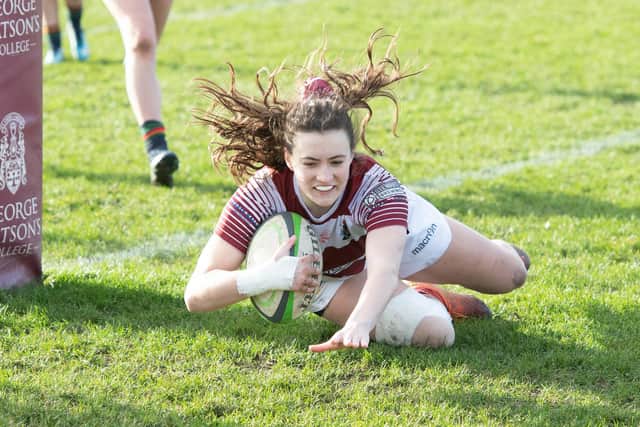 Player of the match Briar-Anne McNamara dives down for one of her three tries