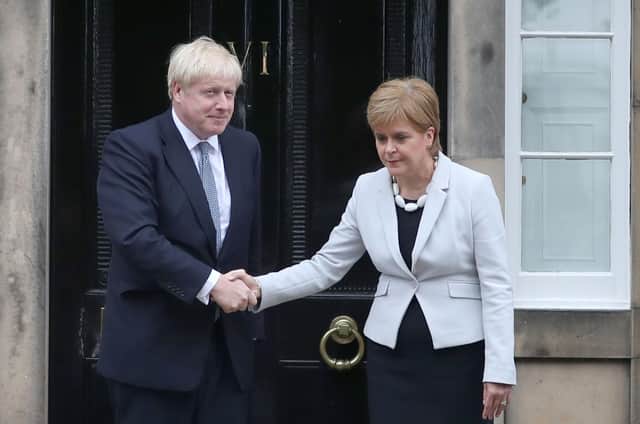 Nicola Sturgeon and Boris Johnson meet outside Bute House in Edinburgh (Picture: Jane Barlow/PA)