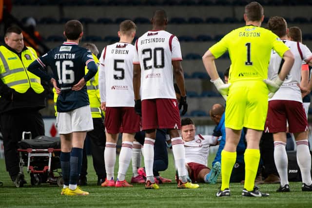 Dylan Tait receives treatment before being stretchered off during Arbroath's 1-1 draw at former club Raith Rovers