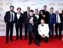 Tommy Jessop (centre), Martin Compston, Gregory Piper, Craig Parkinson, Daniel Mays and the cast and crew of Line of Duty in the press room after winning the Special Recognition Award at the National Television Awards 2021 held at the O2 Arena, London.