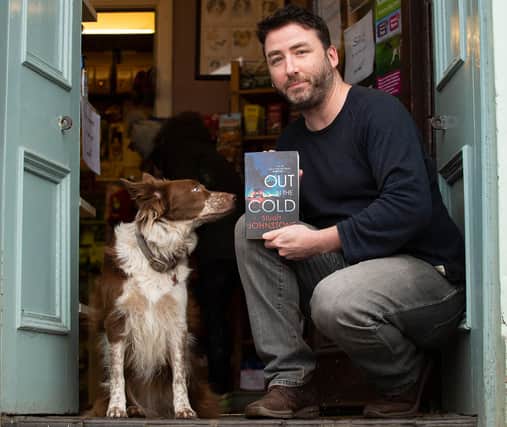 Former policeman and Stockbridge dog shop owner Stuart Johnstone with Holly the dog