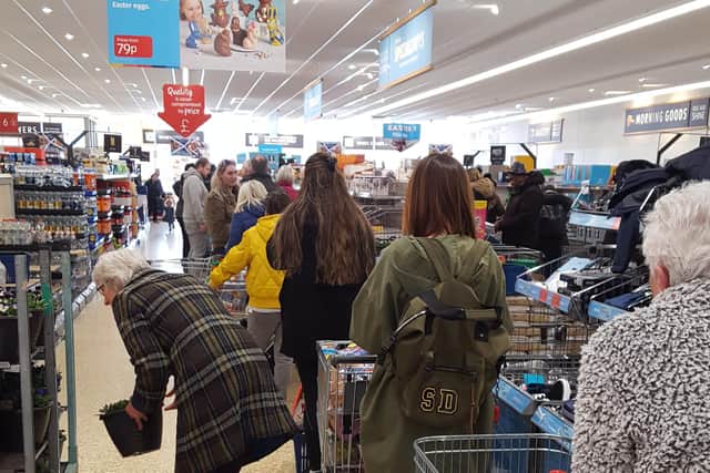 Shoppers queue up in the Aldi Chesser store on Thursday morning. Pic: Tam Carr