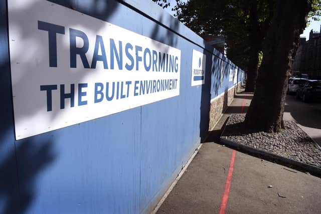 Owners of the 'ransom strip' painted a red line to show they meant business in their dispute over access to the shops