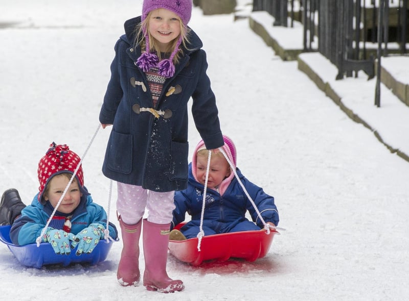 A wee Edinburgh local pulled her brother and sister along on their sledges in Northumberland Street, Edinburgh.