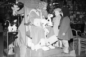 Children meet Santa Claus in Jenners in December 1958.