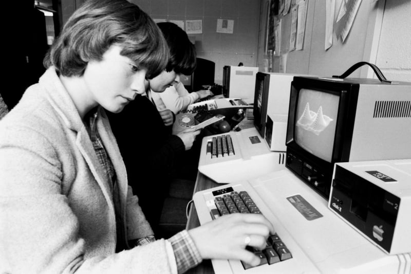 Secondary school pupils work with the latest Apple II computers at the Wester Hailes Education Centre (WHEC) in Edinburgh, October 1980.