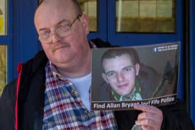 Allan Bryant Snr with a picture of his missing son at a protest outside Fife Police HQ in Glenrothes in 2016 (Pic: Steve Brown)