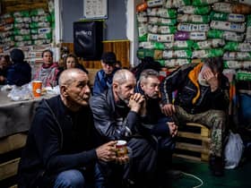 Ukrainians take shelter in a humanitarian aid centre in the besieged town of Bakhmut on Monday (Picture: Dimitar Dilkoff/AFP via Getty Images)
