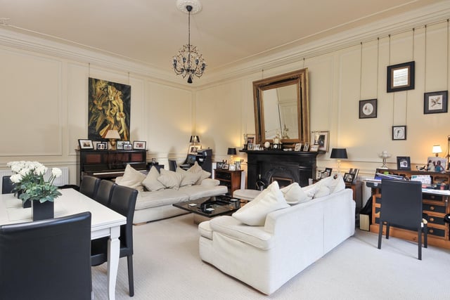 The other reception room is a beautifully decorated drawing room that the current owners use as their everyday living and dining space. The room is flooded with light by huge south facing windows and has an impressive fireplace.