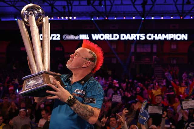 Scotland's Peter Wright celebrates with the Sid Waddell trophy, for the William Hill sponsored PDC World Darts Championship after beating England's Michael Smith in the final at Alexandra Palace.