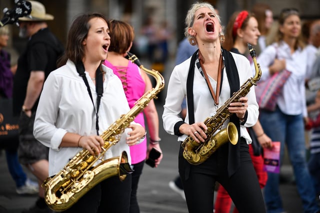 Edinburgh Festival Fringe entertainers perform on the Royal Mile on August 6, 2019 in Edinburgh.