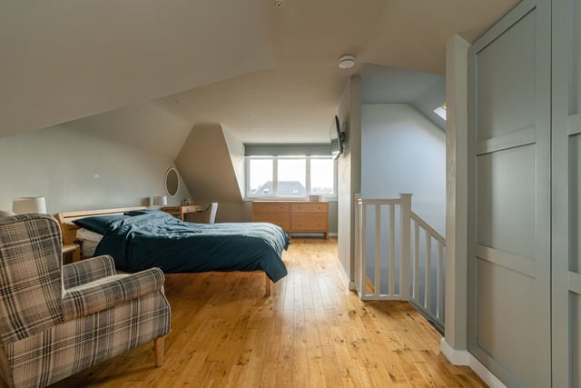 The property's upper level includes a luxury principal bedroom complete with solid wood flooring, walk in wardrobe and impressive en-suite.