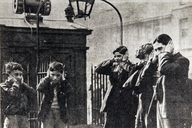 Children hear air raid sirens at Tollcross, 1939.