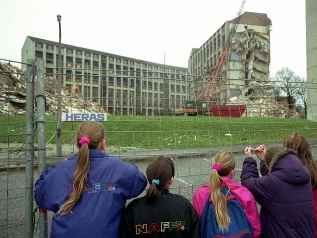 Children can be seen here watching the old Westburn blocks of flats being torn down at Wester Hailes, Edinburgh. This picture was taken in January, 1993.