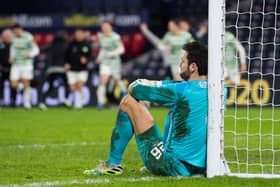 A dejected Craig Gordon sits against the post after Hearts' defeat to Celtic on Sunday.
