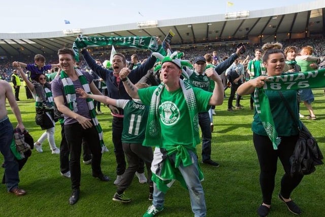 Fans celebrated on the pitch after David Gray's late winner. Picture: Robert Perry