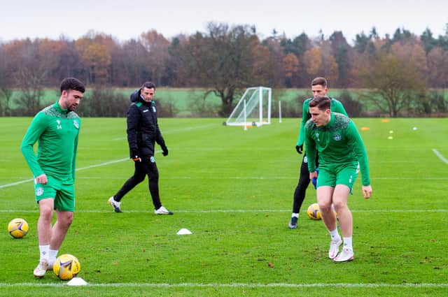 Jack Ross keeps a close eye on training - the Hibs head coach could welcome back two stalwarts for this weekend's match at Motherwell