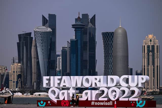 Tourists visit the corniche adorned with a FIFA sign in Doha ahead of the Qatar 2022 FIFA World Cup. Picture: Jewel SAMAD / AFP