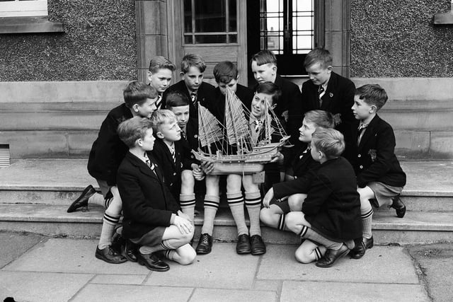 Royal High School prep boys with a model of a Chinese junk in June 1958.