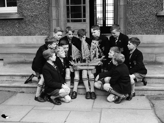 Royal High School prep boys with a model of a Chinese junk in June 1958.