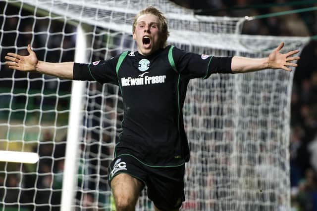 Danny Galbraith rushes to celebrate in front of the Hibs fans after netting the winning goal at Celtic Park. Picture: SNS