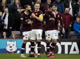 Jorge Grant celebrates with his Hearts team-mates after making it 3-0 to the hosts against St Johnstone. Picture: SNS