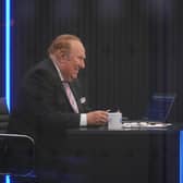 Presenter Andrew Neil prepares to broadcast from a studio during the launch event for new TV channel GB News.