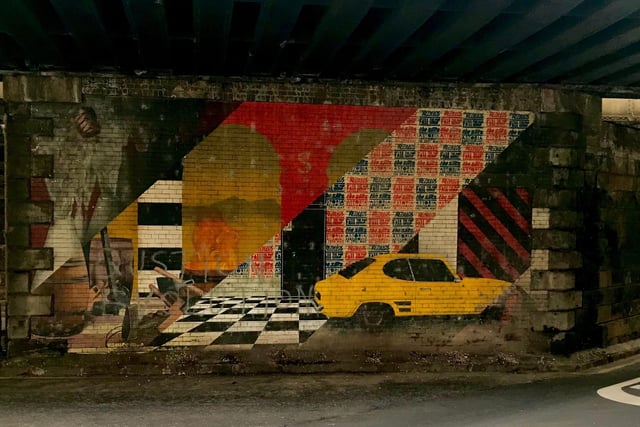 Created by Fraser Gray and Ben Fist, the Abbeyhill Mural reflects a timeline of the local area. The eye-catching artwork includes depictions of the former coopers workshop, the famous checkerboard floor from the former venue, the Astoria and a yellow Cortina – a car that was being worked on at a local garage at the time of the mural’s creation.