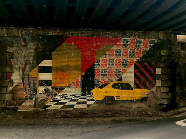 Created by Fraser Gray and Ben Fist, the Abbeyhill Mural reflects a timeline of the local area. The eye-catching artwork includes depictions of the former coopers workshop, the famous checkerboard floor from the former venue, the Astoria and a yellow Cortina – a car that was being worked on at a local garage at the time of the mural’s creation.