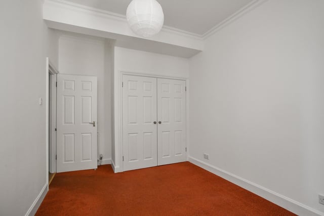 The property's principal bedroom, with good fitted wardrobe space.