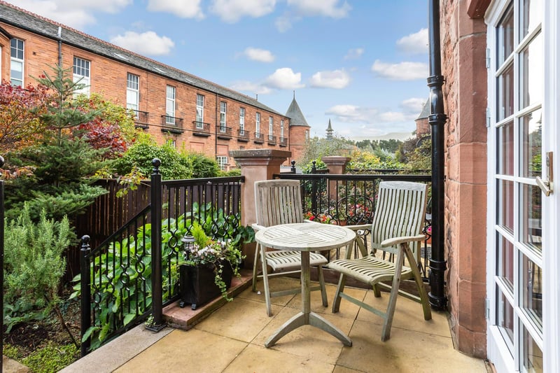 The rear garden also features a neat lawn and a patio for alfresco dining in the sun. In addition, there is a private driveway with an electric vehicle charging point, and a second parking space.