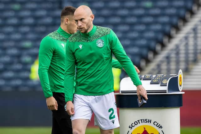 Dejection for Hibs captain David Gray as he collects his runners-up medal at the end of the final