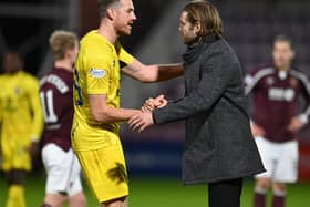 Hearts boss Robbie Neilson shakes hands with Jordan White after the 2-1 victory over Ross County at Tynecastle. Picture: SNS