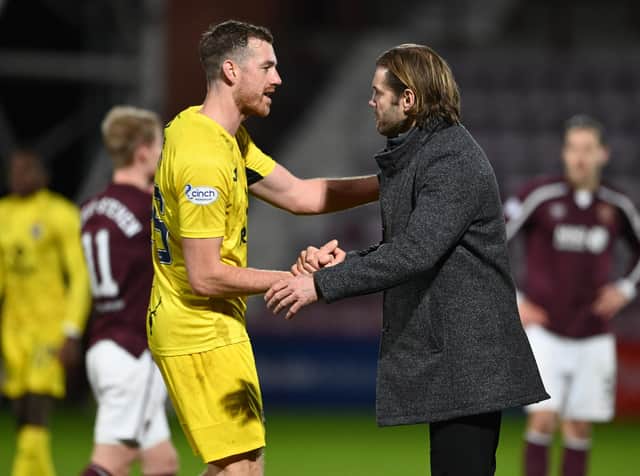 Hearts boss Robbie Neilson shakes hands with Jordan White after the 2-1 victory over Ross County at Tynecastle. Picture: SNS