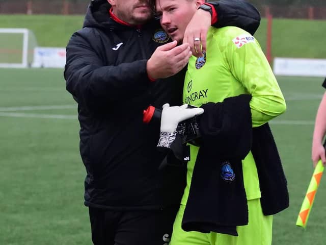 Dunbar boss Kevin Haynes celebrates with goalkeeper Shea Dowie after their 3-0 win [Pic: Dunbar United]