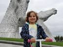 Five year old leukaemia patient Mila Sneddon scooting around The Kelpies to raise money for Blood Cancer UK. Picture: Michael Gillen