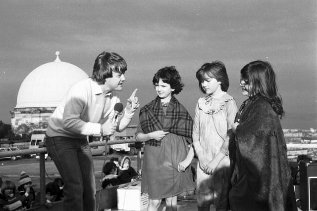 Presenter Keith Chegwin chats to some children from Edinburgh Theatre Workshop when the Swap Shop television programme is filmed at Calton Hill in February 1982.