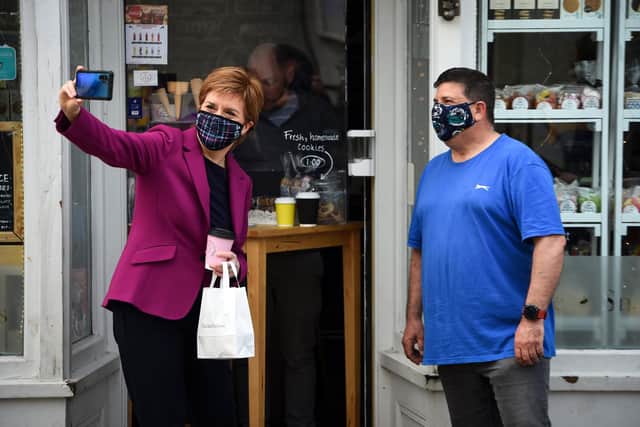 Nicola Sturgeon takes a selfie while campaigning in South Queensferry (Picture: Andy Buchanan/pool/Getty Images)