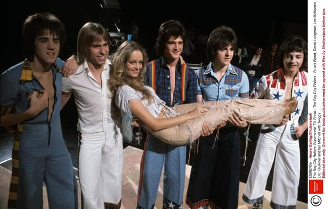 The Bay City Rollers: Stuart Wood, Derek Longmuir, Les McKeown, Eric Faulkner and Ian Mitchell with Twiggy
Photo: Andre Csillag/Shutterstock