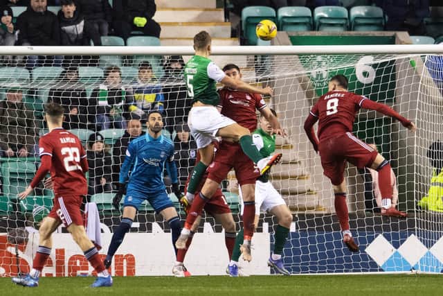 Ryan Porteous rises highest to score the only goal of the game as Hibs defeat Aberdeen in Shaun Maloney's first match in charge. Picture: SNS