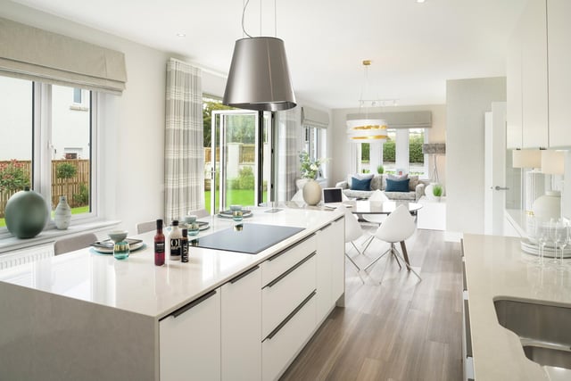 The kitchen and dining area from a different angle illustrates the space available in this beautiful family home.