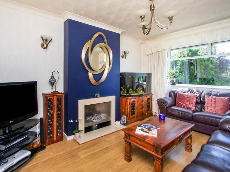 This bright and cosy lounge is the perfect place to relax. It features a gas log fire, radiator and double-glazed window to the front of the house.