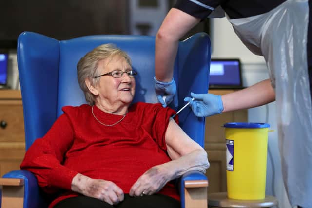 Resident Annie Innes, 90, receiving the Pfizer/BioNTech COVID-19 vaccine at the Abercorn House Care Home in Hamilton.